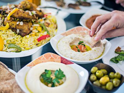Dinning table filled with different mezze.